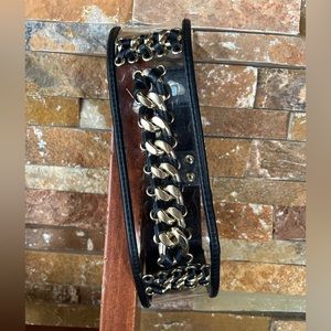 Gold chained waist cinching belt with clear plastic and black synthetic leather